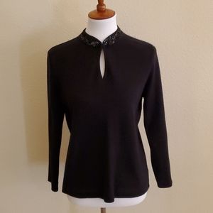 Black sweater with beaded keyhole design